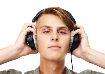 Man, face and portrait with headphones listening to music in audio streaming against a studio background. Closeup of male person, DJ or model with headset for podcast, beats or sound track on mockup