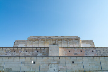 The famous bleachers in the "Zeppelinfeld" (meaning: Zeppelin field), in Nuremberg, Bavaria, Germany. From the podium the nazi dictator spoke to the people. Blue sky on the background. © Travelling Jack