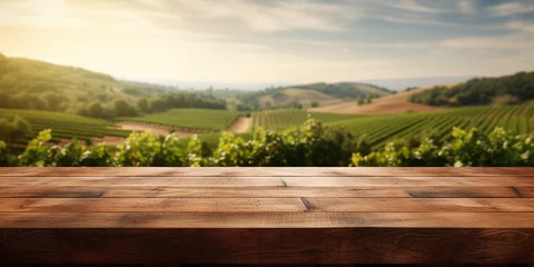 Zelfklevend Fotobehang Wood table top on blurred vineyard landscape background © Ricardo Costa