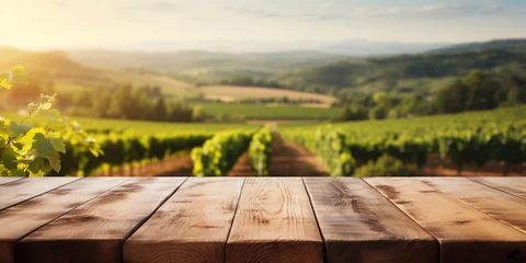 Zelfklevend Fotobehang Wood table top on blurred vineyard landscape background © Ricardo Costa