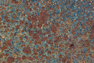 Grunge rusty metal background or texture with scratches and cracks, closeup, top view