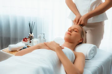 Türaufkleber Caucasian woman enjoying relaxing anti-stress head massage and pampering facial beauty skin recreation leisure in dayspa modern light ambient at luxury resort or hotel spa salon. Quiescent © Summit Art Creations