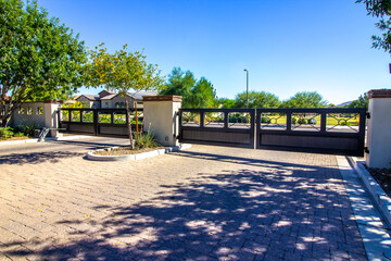 Entrance And Exit Gates To Secure Subdivision - obrazy, fototapety, plakaty