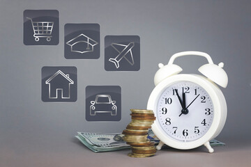 White alarmclock with coins stack and stack of one hundred dollar bills with Digital symbol investment for future on grey background. Interest rate dividend, investment, dividend tax, stock market.