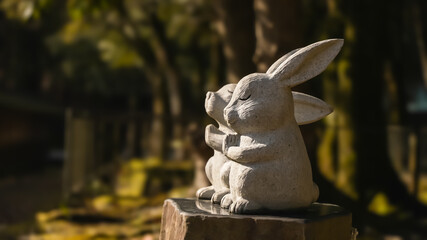 Stone statue of two white rabbits praying at Izumo Taisha Shrine