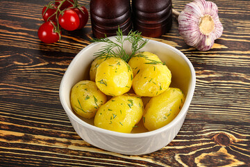 Boiled potato with oil and dill