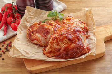 Marinated chicken leg in tomato sauce