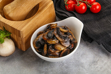 Roasted champignon mushrooms in the bowl