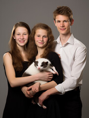A Studio Portrait Photo of a Young Family Posing with a Ferret