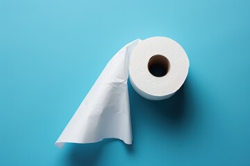 Toilet paper roll on blue background, top view. Hygiene concept. Hygiene concept with a copy space.