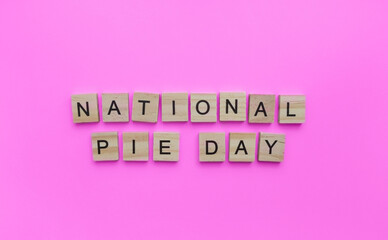 January 23, National Pie day, minimalistic banner with the inscription in wooden letters