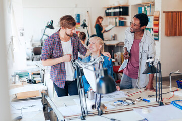 Diverse trio of designers working in a modern office