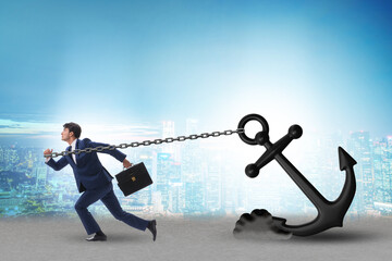 Businessman with anchor in business concept