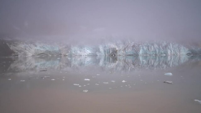 arctic glacier under the fog in Greenland 