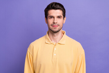 Obraz premium Photo of positive cheerful young man dressed yellow shirt smiling isolated purple color background