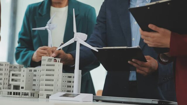 Business team people meeting and talking with engineer and architecture about planning and drawing of building construction project, smart executive professional working at outdoor, teamwork concept