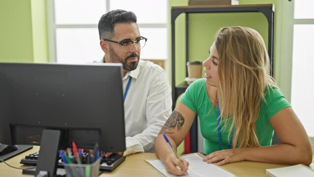 Man and woman business workers working high fiver with hands raised up at office
