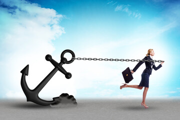 Businesswoman with anchor in business concept