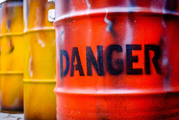 old barrels with danger sign