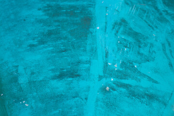Turquoise abstract with possible brush marks 