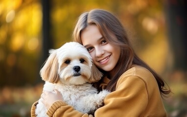 Teenage girl hugging her lovely dog