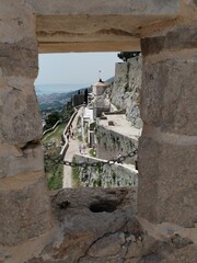 view of the old fortress the wall klis fortress in split Croatia downtown medieval town streets and buildings highlights 