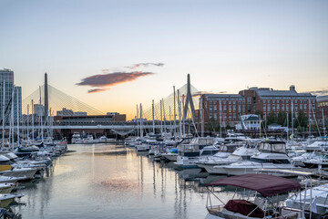 Yachts and boats at the berths in one of the evening Boston bays in New England