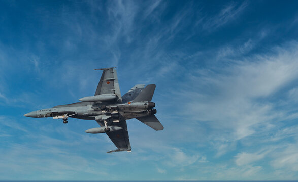 F18 Super Hornet, Military Jet fighter aircraft fly in the sky.
Las Palmas, Canary Island, Spain, October /16/2023. Military jet fighter flies around the canary island for training purposes.