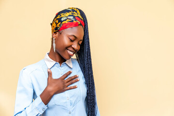 woman wearing a blue shirt and a head scarf - obrazy, fototapety, plakaty