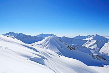 Fototapeta na wymiar the swiss alps covered in snow under a clear, blue sky