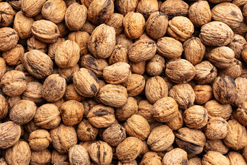 several walnuts in shell seen from above