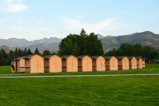 wooden houses kiosks for street trading in the open air. rows of wooden houses against the backdrop of mountains