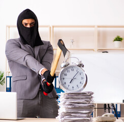 Male gangster stealing information from the office