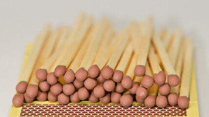 Box of matches and close-up detail of safety match.