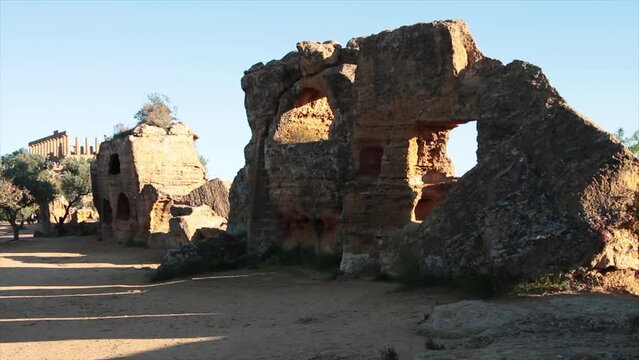 agrigento sicily italy mountain top mountaintop cliff ancient ruins wide medium shot by temple of juno concordia pillars