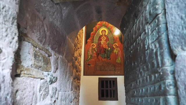 The entrance door to the Saint Catherine Monastery with the icon on the wall. Ancient historical religious place at Mount Sinai. Tourist excursion to the Mountain of Moses