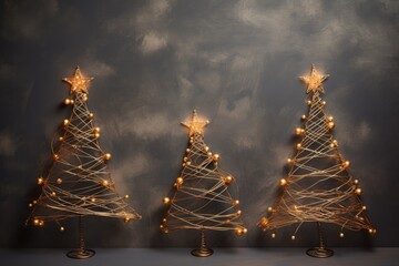 Three alternative christmas tree made of wire strings with gold star and beads on grey background. Sustainable Christmas and new year, zero waste, eco friendly concept
