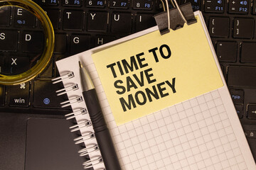 Time to save money symbol. Yellow steaky note with words Time to save money. Beautiful deep blue background.