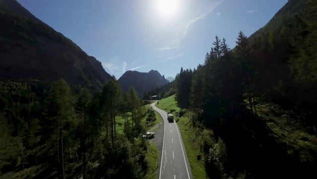 areal footage of truck going uphill in epic alp mountains 