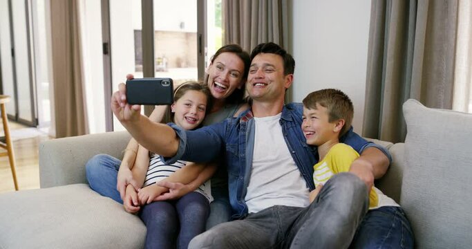 Happy family, mom or father in selfie with kids on sofa to relax on social media together for memory. Parents, vlog or excited dad hug for picture or photograph with love or children siblings in home
