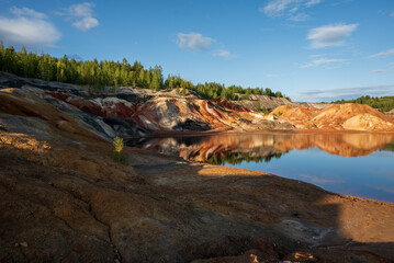 Ural apocalyptic surreal landscape, similar to the surface of the planet Mars. Barren, cracked and scorched earth and soil. The concept of global warming. Clay quarries