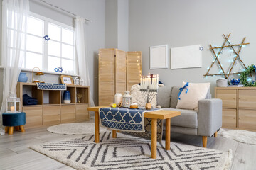 Interior of living room decorated for Hannukah with sofa and table