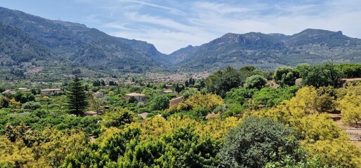 valley Surrounded by orchards of fruit trees and orange trees, we find the town of Sóller with its historic center of narrow cobbled streets, full of elegant modernist mansions and traditional Mallorc © Michaela Holubová
