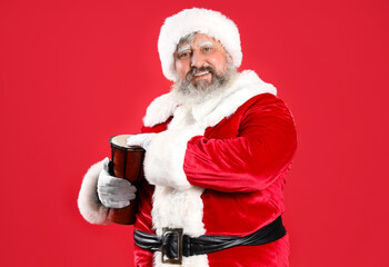 Cool Santa Claus playing djembe on red background