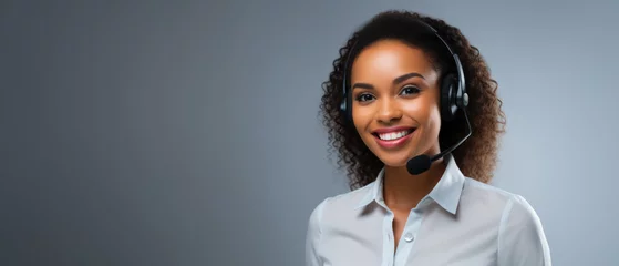 Foto op Canvas Call center, black young woman and smile in contact us with CRM, headset with mic and mockup space. Customer service, happy female and telemarketing with sales and help desk. gray background,  © Adriana