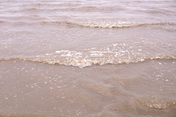 Fototapeta na wymiar beautiful waves in a sand