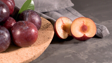 Red plums in a cork plate