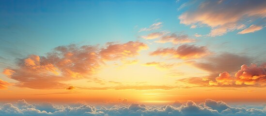 Fototapeta premium Summer morning with orange and yellow sunrise illuminating the cloudy sky at sunset