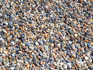 background of colorful pebbles on the beach