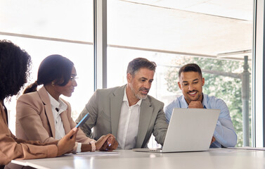 Diverse business team people using laptop computer at office meeting. International professional...